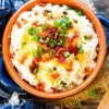 A bowl of creamy Loaded Mashed Potatoes
