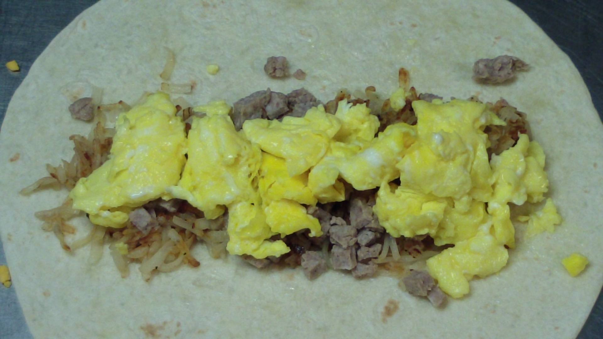 hash brown breakfast burrito with sausage, egg and cheese