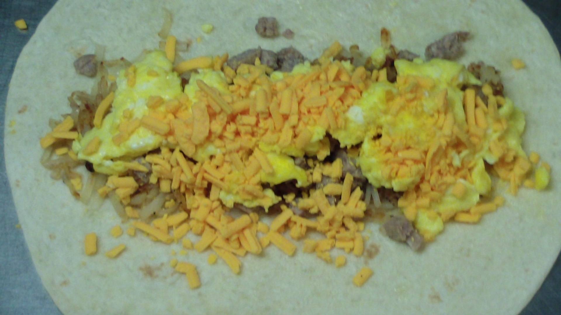 hash brown breakfast burrito with sausage, egg and cheese